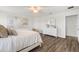 Bright bedroom with a ceiling fan, wood floors, ample space, and a light and airy feel at 6708 162Nd E Pl, Parrish, FL 34219