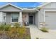 Inviting front porch with a cozy seating area and tasteful landscaping at 6708 162Nd E Pl, Parrish, FL 34219