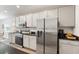 Gourmet kitchen with stainless steel appliances, modern cabinets, and a sleek design at 6708 162Nd E Pl, Parrish, FL 34219