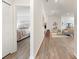 Hallway view into the living room and a peek into a bedroom to the left at 6708 162Nd E Pl, Parrish, FL 34219