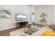 Comfortable living room space with modern decor and a view of the kitchen and dining area at 6708 162Nd E Pl, Parrish, FL 34219