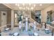 Formal dining room featuring modern decor and seating for six at 6916 Prairie Oak Way, Nokomis, FL 34275