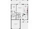 Detailed first floor plan showing layout of kitchen, living area, bedrooms, and garage at 7009 Foxboro Way, Nokomis, FL 34275