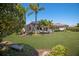 Private backyard with a screened pool area and lush greenery for relaxation and entertainment at 7011 Belmont Ct, Lakewood Ranch, FL 34202
