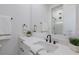 Clean bathroom featuring a large mirror, sleek black hardware, and modern fixtures at 7011 Belmont Ct, Lakewood Ranch, FL 34202