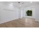 Large bedroom showcasing decorative wall moldings, archway, and an abundance of natural light at 7011 Belmont Ct, Lakewood Ranch, FL 34202