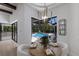 Bright dining area with backyard pool and view at 7011 Belmont Ct, Lakewood Ranch, FL 34202