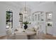 Dining area featuring a table set for a meal and built-in display cabinets at 7011 Belmont Ct, Lakewood Ranch, FL 34202
