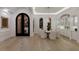 Elegant dining room with ornate door, lighting fixture, and luxury design at 7011 Belmont Ct, Lakewood Ranch, FL 34202