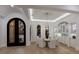 Elegant dining room with ornate door, lighting fixture, and luxury design at 7011 Belmont Ct, Lakewood Ranch, FL 34202