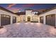 Long driveway leading to a luxury home with fountain and three-car garage at 7011 Belmont Ct, Lakewood Ranch, FL 34202