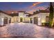 Expansive home exterior with driveway, decorative fountain and attached garages at 7011 Belmont Ct, Lakewood Ranch, FL 34202