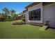 Charming home exterior with a pet ramp, well-kept lawn, and lush landscaping at 7011 Belmont Ct, Lakewood Ranch, FL 34202