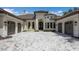 Stately home with manicured landscaping, a circular driveway, and elegant architectural details at 7011 Belmont Ct, Lakewood Ranch, FL 34202