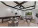 Bright game room with a shuffleboard table, comfortable seating, and a view of the outdoors at 7011 Belmont Ct, Lakewood Ranch, FL 34202