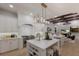 Modern kitchen with stainless steel appliances, large island, and open floor plan at 7011 Belmont Ct, Lakewood Ranch, FL 34202