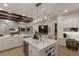 Spacious open kitchen features a large island, wine cooler and seating at 7011 Belmont Ct, Lakewood Ranch, FL 34202