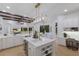 The kitchen features an island, stainless steel appliances, and a breakfast bar at 7011 Belmont Ct, Lakewood Ranch, FL 34202