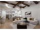 Open concept living room boasting wood floors, beamed ceilings, and stylish decor at 7011 Belmont Ct, Lakewood Ranch, FL 34202