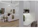 Living room featuring fireplace, hardwood floors, and a desk nook adjacent at 7011 Belmont Ct, Lakewood Ranch, FL 34202