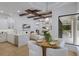 Open floor plan featuring a kitchen, living room, and dining area with hardwood floors at 7011 Belmont Ct, Lakewood Ranch, FL 34202