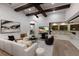 Spacious living room with wood floors and beamed ceilings at 7011 Belmont Ct, Lakewood Ranch, FL 34202
