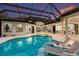 Beautiful pool with sun loungers and an outdoor area, perfect for entertaining at 7011 Belmont Ct, Lakewood Ranch, FL 34202