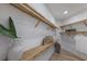 Walk-in closet with wood shelving, and built-in cabinetry at 7011 Belmont Ct, Lakewood Ranch, FL 34202