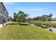 Scenic backyard with a canal providing a serene outdoor space at 7218 Cloister Dr # 7218, Sarasota, FL 34231