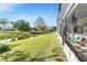 Enjoy peaceful views of the lush backyard and tranquil canal from the screened lanai at 7218 Cloister Dr # 7218, Sarasota, FL 34231