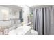 Bright bathroom featuring vanity, modern fixtures, and shower-tub combo at 7218 Cloister Dr # 7218, Sarasota, FL 34231