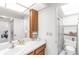Bright bathroom featuring vanity, modern fixtures, and glass-enclosed shower at 7218 Cloister Dr # 7218, Sarasota, FL 34231