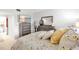 Primary bedroom featuring ensuite bathroom and a dresser with large mirror, plus bedside tables at 7218 Cloister Dr # 7218, Sarasota, FL 34231