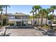 Exterior view of the building with access to the community pool area at 7218 Cloister Dr # 7218, Sarasota, FL 34231