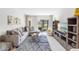 Cozy living area with plush seating, a view of the outdoors, and stylish decor at 7218 Cloister Dr # 7218, Sarasota, FL 34231