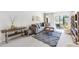 Comfortable living room featuring modern furniture, a view of the backyard, and neutral tones at 7218 Cloister Dr # 7218, Sarasota, FL 34231