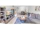 Inviting living room showcasing modern decor, plush seating, and seamless flow to dining area at 7218 Cloister Dr # 7218, Sarasota, FL 34231