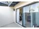 Outdoor patio space with sliding glass door offering indoor-outdoor flow at 7218 Cloister Dr # 7218, Sarasota, FL 34231