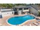 Outdoor pool area with brick patio and lounge chairs for relaxation at 7218 Cloister Dr # 7218, Sarasota, FL 34231