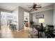 Open floor plan with a dining area that leads to a breakfast bar and kitchen featuring stainless steel appliances at 7607 Grand Estuary Trl # 302, Bradenton, FL 34212