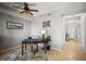 Dining room features tile flooring, a ceiling fan, and view of the hallway leading to the main entrance at 7607 Grand Estuary Trl # 302, Bradenton, FL 34212