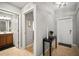 Entryway features neutral colors, tile flooring and a hall table at 7607 Grand Estuary Trl # 302, Bradenton, FL 34212