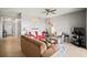 Spacious living room featuring tile floors, neutral walls, contemporary decor, and comfortable seating at 7607 Grand Estuary Trl # 302, Bradenton, FL 34212