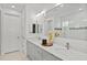 Modern bathroom featuring double vanity, quartz countertops, and a glass-enclosed shower at 8107 Slipway Dr, Sarasota, FL 34240