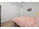 Bedroom with wood floors, ceiling fan, and simple decor at 8107 Slipway Dr, Sarasota, FL 34240