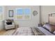 Cozy bedroom with window views, a comfortable chair, and stylish décor at 8107 Slipway Dr, Sarasota, FL 34240