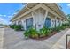 Charming boathouse with blue accents and well-maintained landscaping, adding to the community's recreational amenities at 8107 Slipway Dr, Sarasota, FL 34240