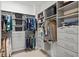 Well-organized walk-in closet with shelving, drawers, and ample storage space at 8107 Slipway Dr, Sarasota, FL 34240