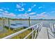 Community dock featuring modern amenities and easy access to the water, perfect for boating and enjoying waterfront activities at 8107 Slipway Dr, Sarasota, FL 34240