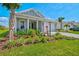 Alluring single-story home complemented by colorful landscaping and an attractive paver driveway at 8107 Slipway Dr, Sarasota, FL 34240